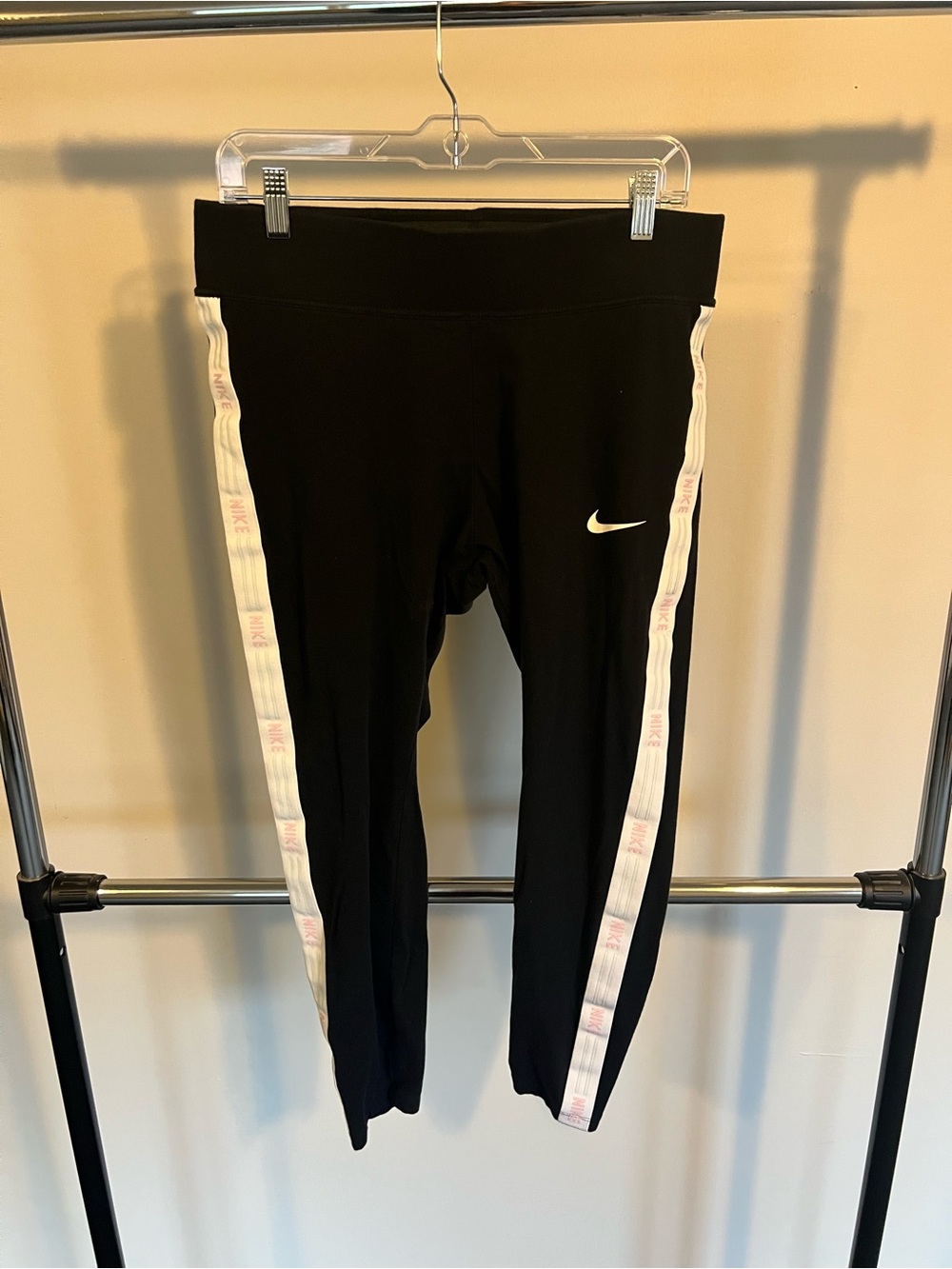 Nike Black Women’s Leggings with the White Side Tape and Pink/Blue Logo Accents